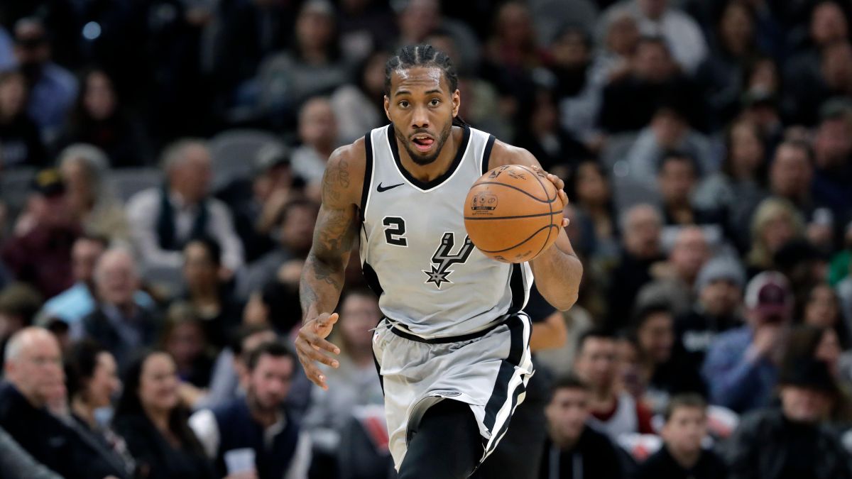 In this Jan. 13, 2018, file photo, San Antonio Spurs forward Kawhi Leonard (2) moves the ball up court during the second half of an NBA basketball game against the Denver Nuggets, in San Antonio. The absolute unwillingness to answer certain questions is part of the San Antonio Spurs’ mystique. The Spurs just don’t share much. So there is some unmistakable irony here that when it comes to the obviously fractured relationship between San Antonio and Kawhi Leonard, it’s the Spurs who are the ones frustrated by the lack of answers. (Eric Gay / Associated Press)
