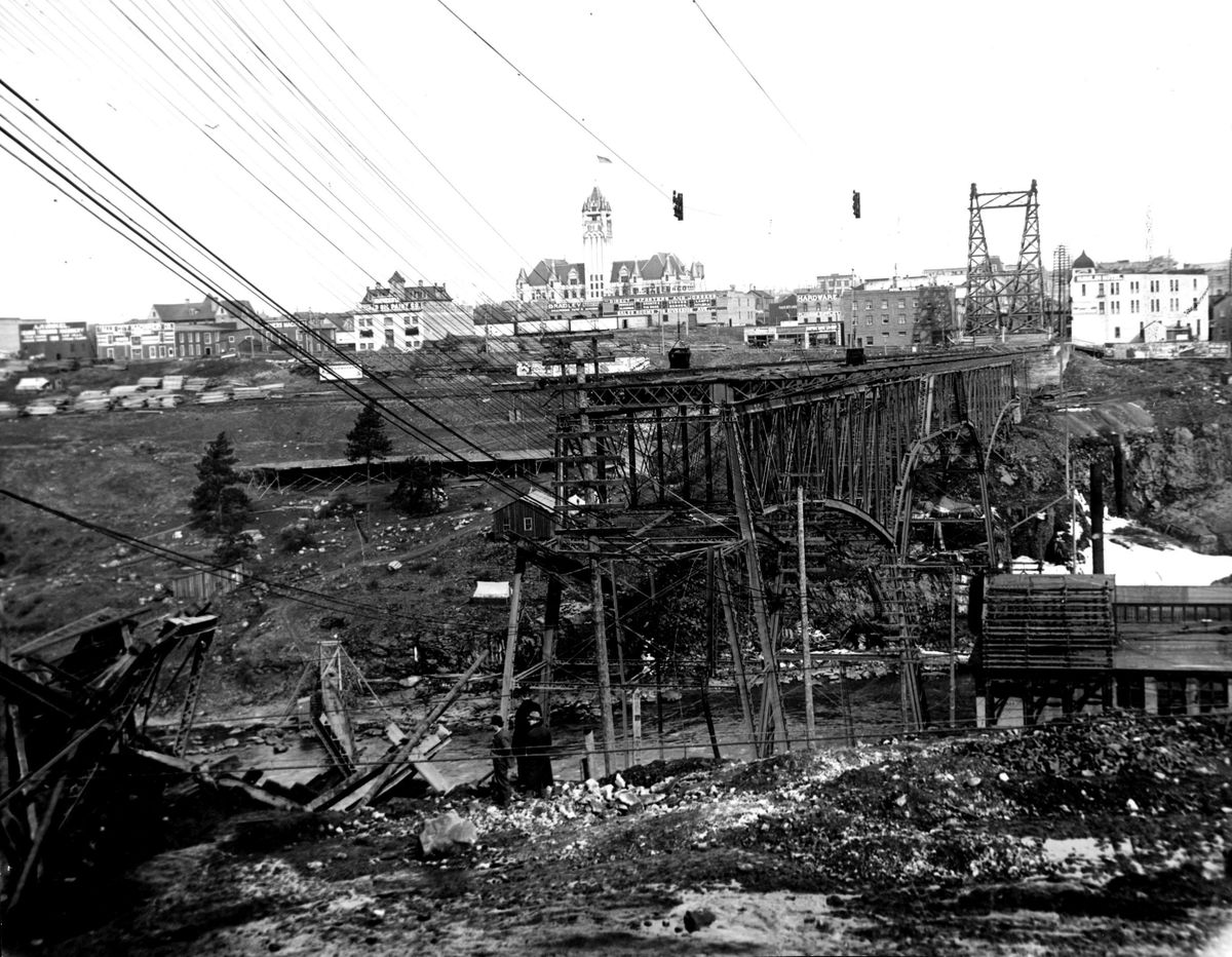 The second Monroe Street Bridge was a steel structure built 1892. It is pictured here after a 100-foot section collapsed in 1910 during the construction of our current concrete version. A city engineer at the time said a cyclonic wind caused the collapse, but it was never determined whether wind, added weight of steel reinforcement or an earth slide was the actual cause. (PHOTO ARCHIVE / SR)