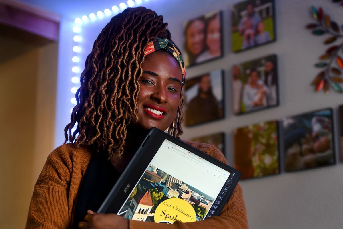 Stephaine Courtney holds the e-book she created highlighting Spokane’s Black leaders at her home in Spokane on Friday.  (Kathy Plonka/The Spokesman-Review)
