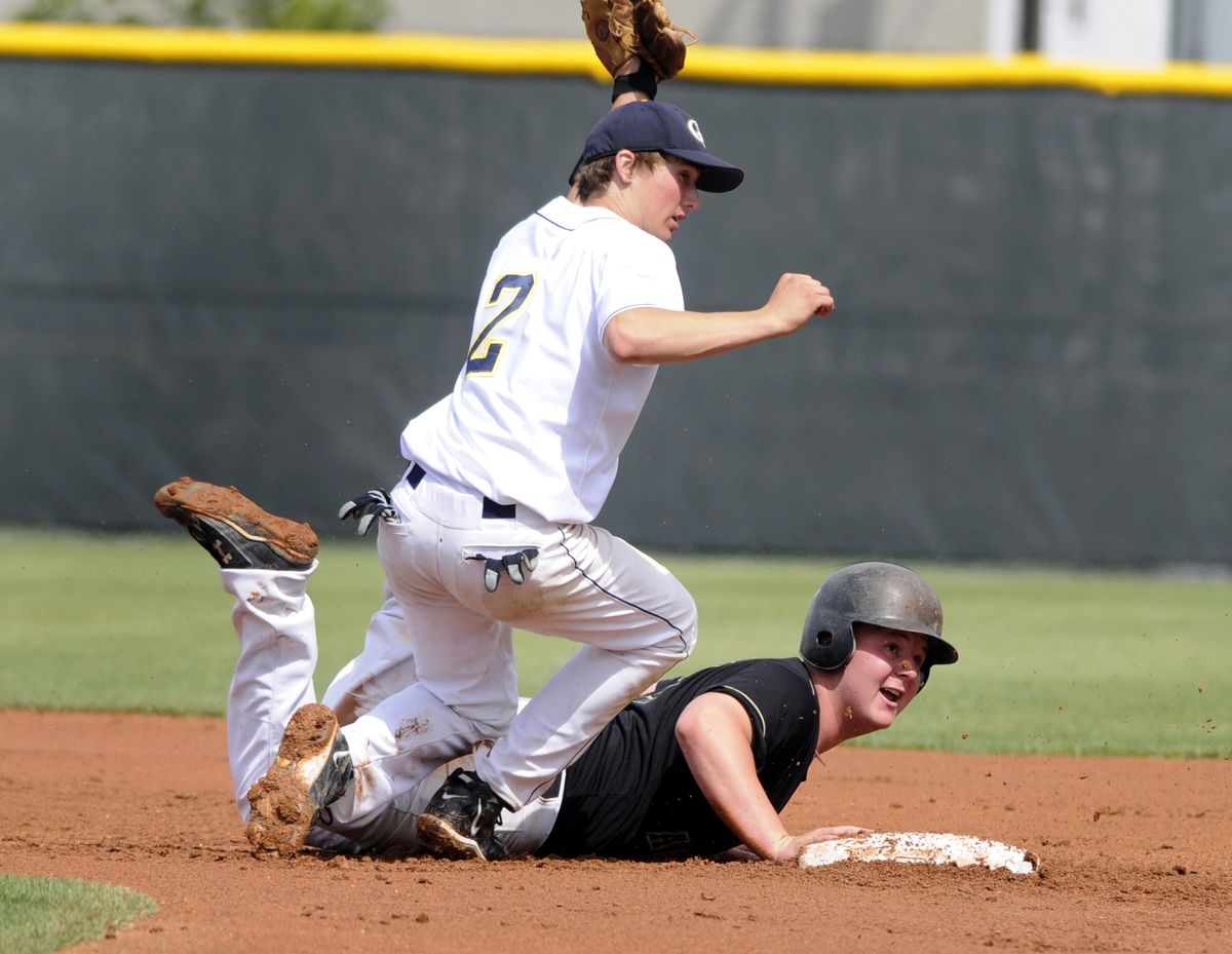 Prospect Baseball Academy’s Dennis Millar looks at the umpire with dismay after being tagged out by Great Falls Chargers shortstop Skyler Smith.  (J. BART RAYNIAK)