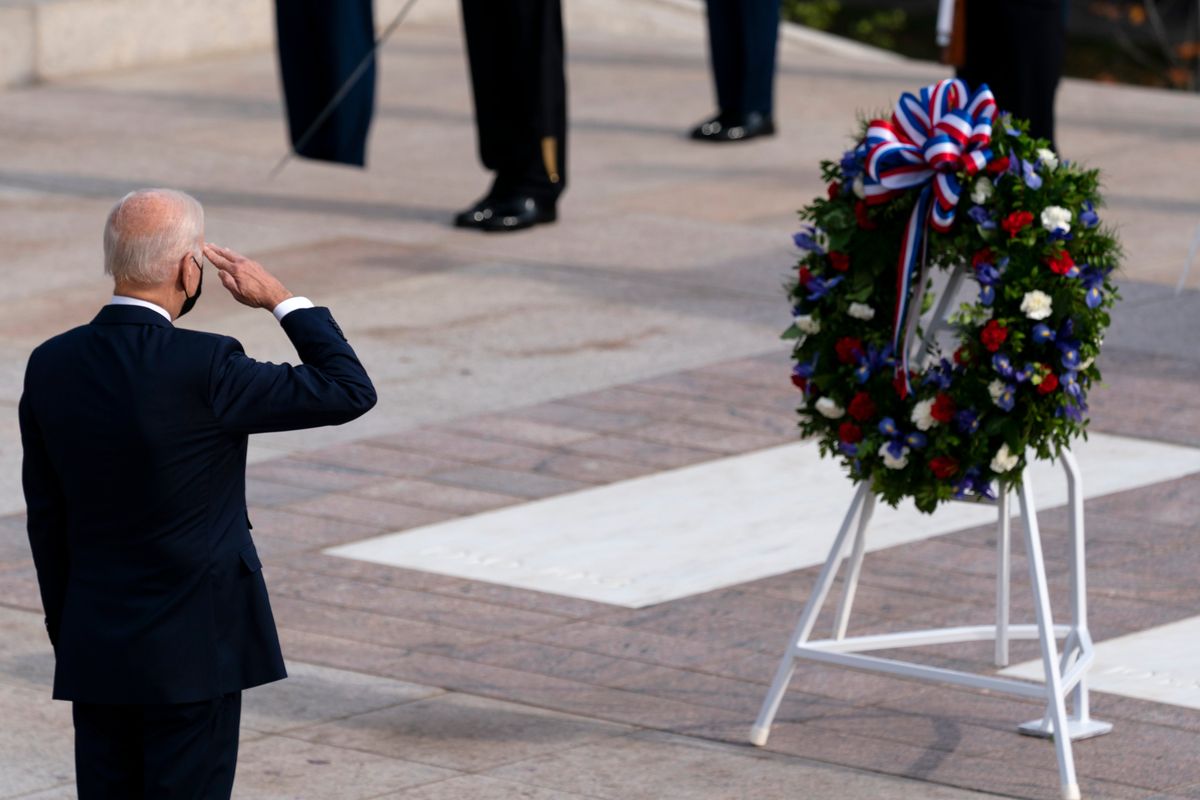 President Joe Biden salutes after placing a wreath during a ceremony for the Tomb of the Unknown Soldier, Thursday at Arlington National Cemetery in Virginia. (Alex Brandon)