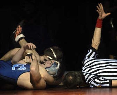 
Central Valley wrestler Jordan Choate, bottom, is pinned by University High's Jacob Mason in the 145-pound class. Mason won the match. 
 (Brian Plonka / The Spokesman-Review)