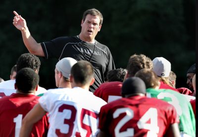 Head coach Paul Wulff  gives Cougar players a closing talk during football practice Wednesday  in Pullman. Tonight’s game against Baylor was originally scheduled for Saturday.The Spokesman Review (TYLER TJOMSLAND The Spokesman Review / The Spokesman-Review)