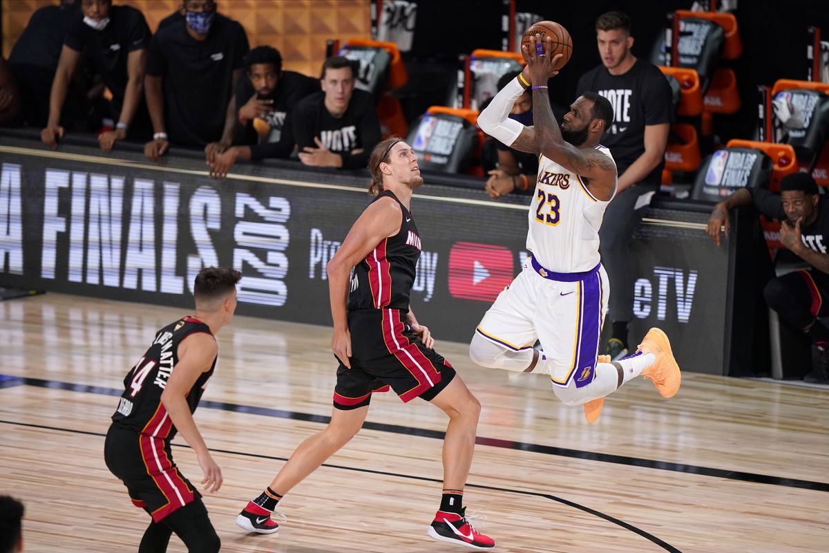 Los Angeles Lakers’ LeBron James (23) takes a shot over Miami Heat’s Kelly Olynyk (9) during the second half in Game 6 of basketball’s NBA Finals Sunday, Oct. 11, 2020, in Lake Buena Vista, Fla.  (Mark J. Terrill)