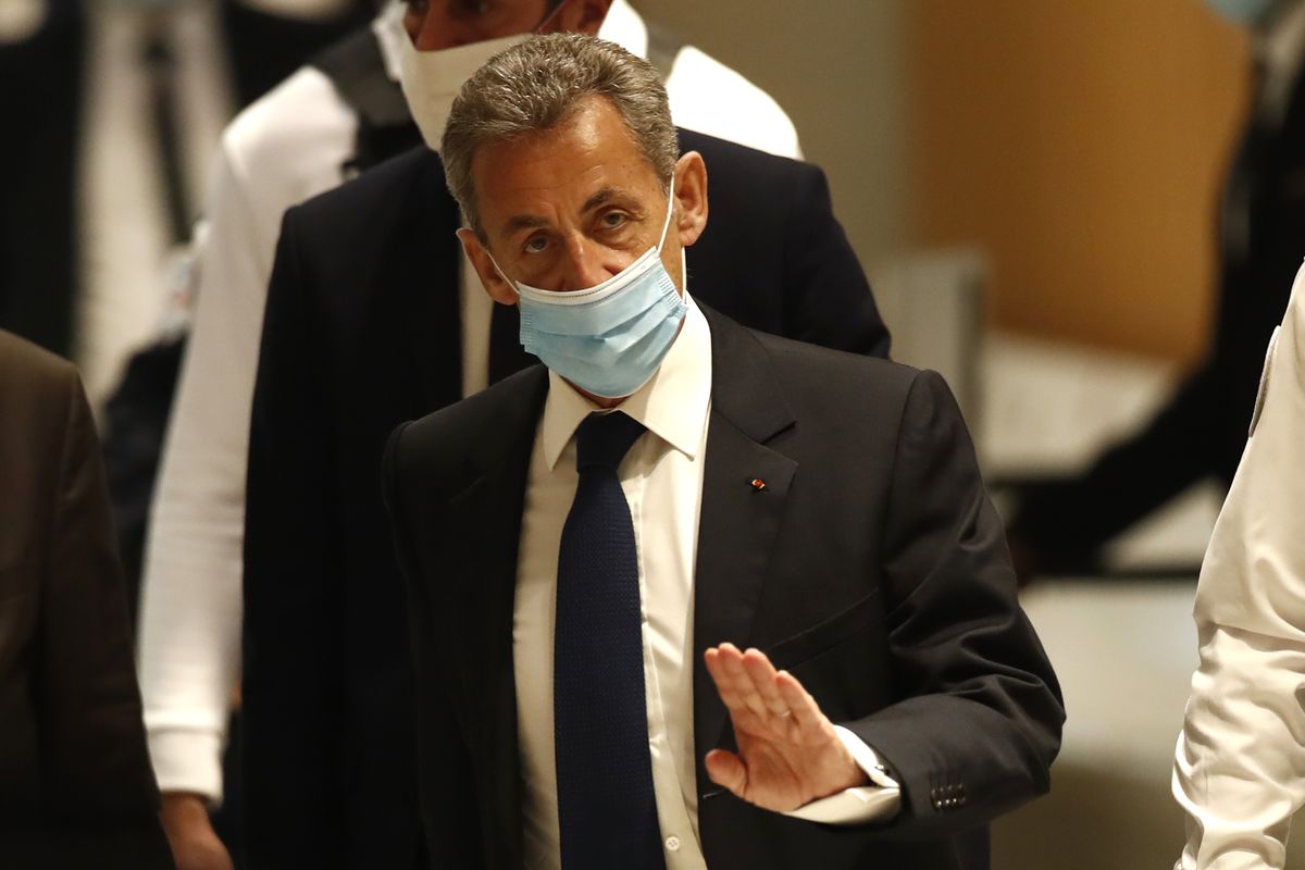 Former French President Nicolas Sarkozy arrives at the courtroom Monday, March 1, 2021 in Paris. The verdict is expected in a landmark corruption and influence-peddling trial that has put French former President Nicolas Sarkozy at risk of a prison sentence if he is convicted. Sarkozy, who was president from 2007 to 2012, firmly denied all the allegations against him during the 10-day trial that took place at the end of last year.  (Michel Euler)