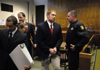 Fred Russell,  27, the former Washington State University student who fled charges in three drunken driving deaths, leaves a Colfax  courtroom after being charged with three additional felony offenses on Monday. 
 (Dan Pelle / The Spokesman-Review)