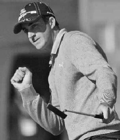 
Geoff Ogilvy, of Australia, pumps his fist as he sinks a birdie putt. 
 (Associated Press / The Spokesman-Review)