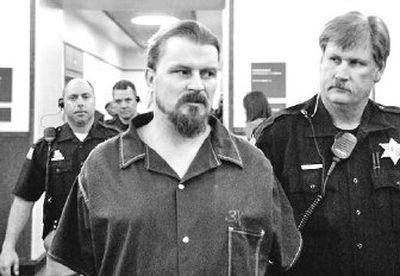 
Karl D. Anderson is led into Judge Ellen Clark's courtroom Wednesday.
 (Dan Pelle / The Spokesman-Review)