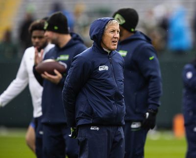 Seahawks coach Pete Carroll watches his team warm up for a game against the Green Bay Packers on Nov. 14 at Lambeau Field in Green Bay, Wisconsin.  (Tribune News Service)