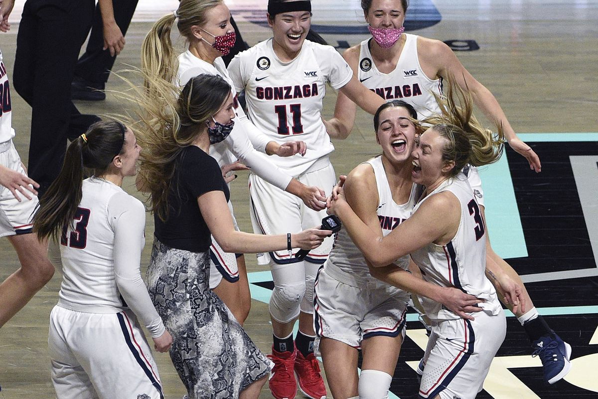 Gonzaga celebrates a victory over BYU in an NCAA college basketball game for the West Coast Conference women