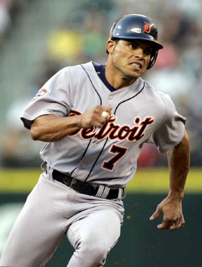 
Detroit Tigers' Ivan Rodriguez heads home on a double in the fourth inning by Dmitri Young against the Mariners on Tuesday.
 (Associated Press / The Spokesman-Review)