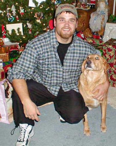 
Robb Long poses for a photo with the family dog during the holidays. 
 (Courtesy of Long family / The Spokesman-Review)