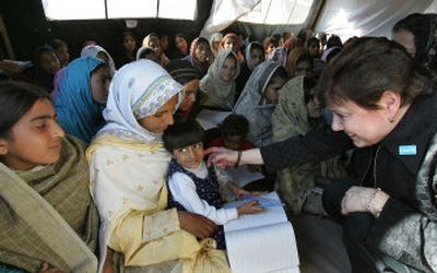 
UNICEF Executive Director Ann Veneman  talks Sunday with Kashmiri students in the makeshift tent they've been using since their school was destroyed by the Oct. 8 earthquake in Muzaffarabad, the capital of Pakistani Kashmir. 
 (Associated Press / The Spokesman-Review)