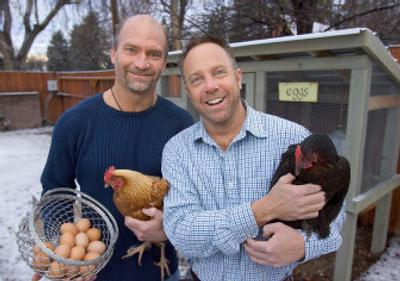 
Shawn Novak, left, and his partner, Dan Searle,  keep three chickens in a wooden coop at their home in Boise.  They often give extra eggs to neighbors and friends. 
 (Associated Press / The Spokesman-Review)