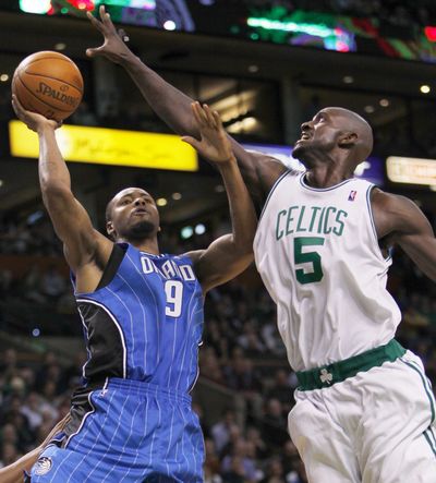 Orlando Magic’s Rashard Lewis (9) shoots over the Boston Celtics’ Kevin Garnett during Orlando’s 83-78 victory.  (Associated Press)