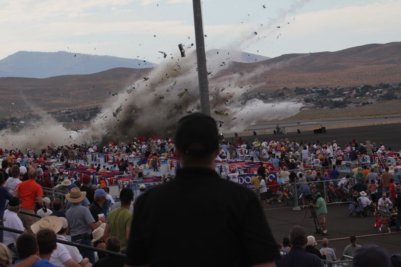 A P-51 Mustang airplane crashes into the edge of the grandstands at the Reno Air show on Friday, Sept. 16, 2011 in Reno Nevada. The World War II-era fighter plane flown by a veteran Hollywood stunt pilot Jimmy Leeward plunged Friday into the edge of the grandstands during the popular air race creating a horrific scene strewn with smoking debris. (Ward Howes / Associated Press)