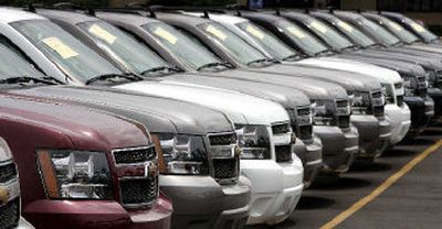 A line of Chevrolet Suburbans sits for sale on a lot in Frederick, Md. Executives of General Motors Corp. and Ford Motor Co. have discussed a possible merger or alliance, the trade journal Automotive News reported Monday.
(Associated Press / The Spokesman-Review)