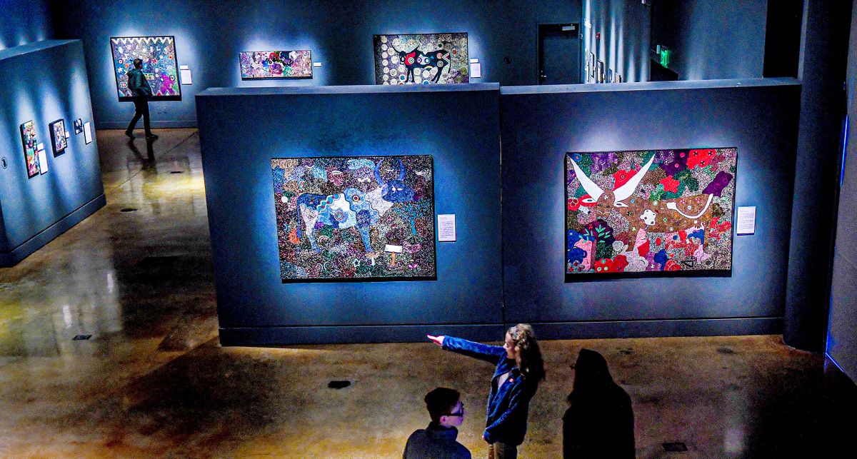 A small crowd roams through the Northwest Museum of Arts and Culture exhibition of beadwork from the South Africa Ubuhle Beads collective on Wednesday. Included in the exhibition is beadwork of Northwest Plateau Tribes from Fred L. Mitchell’s premier collection.  (Kathy Plonka/The Spokesman-Review)