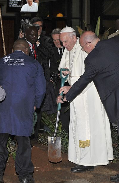 Pope Francis plants a tree during a visit to the United Nations regional office in Nairobi, Kenya, Thursday, Nov. 26, 2015. Pope Francis warned Thursday that it would be “catastrophic” for world leaders to let special interest groups get in the way of a global agreement to curb fossil fuel emissions.