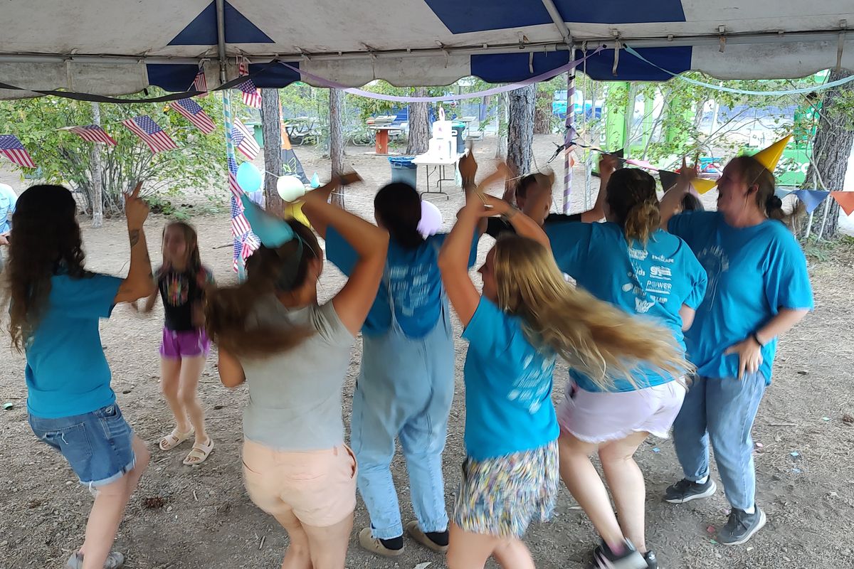 Summer camp counselors and campers let loose celebrating at the Camp Ka-Mee-Lin 30th birthday party held July 24 at Kiwanis Park in Post Falls. Approximately 120 children enjoy camp five days a week for 11 weeks during the summertime. (Lisa Ormond/FāVS News)