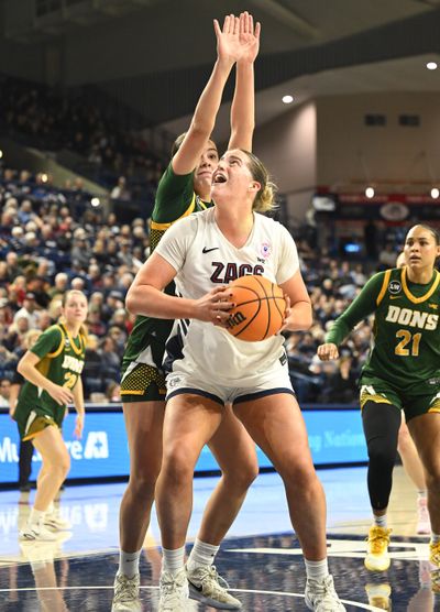 Gonzaga’s Lauren Whittaker looks for a way around San Francisco’s Noelia Mouriño under the basket during a Jan. 15 game at McCarthey Athletic Center.  (Jesse Tinsley/The Spokesman-Review)