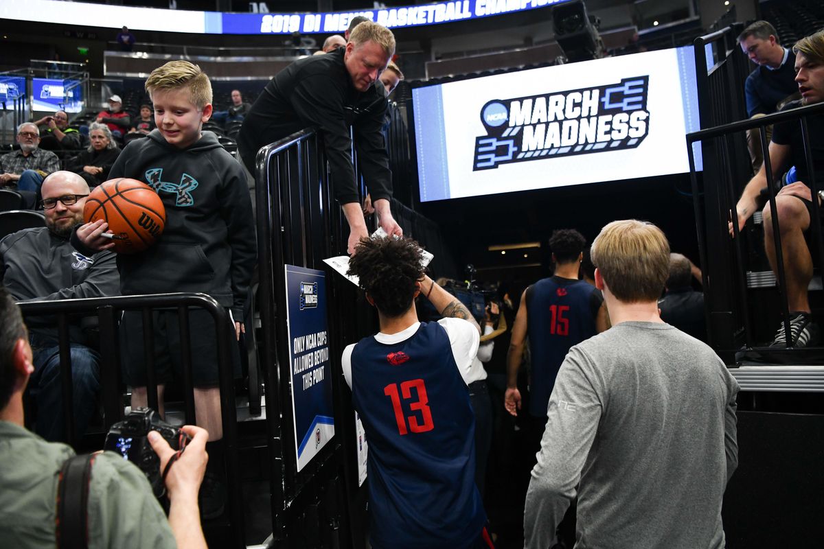 Gonzaga Bulldogs guard Josh Perkins (13) signs memorabilia for a fan after a practice leading up to the first round of the NCAA basketball tournament on Wednesday, March 20, 2019, at Vivint Smart Home Arena in Salt Lake City, Utah. (Tyler Tjomsland / The Spokesman-Review)