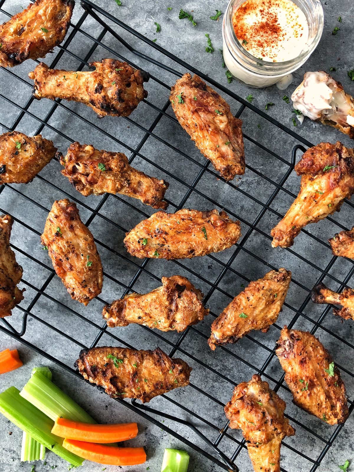 Corn starch in this chicken wing recipe absorbs excess moisture while locking in flavor.  (Audrey Alfaro/For The Spokesman-Review)
