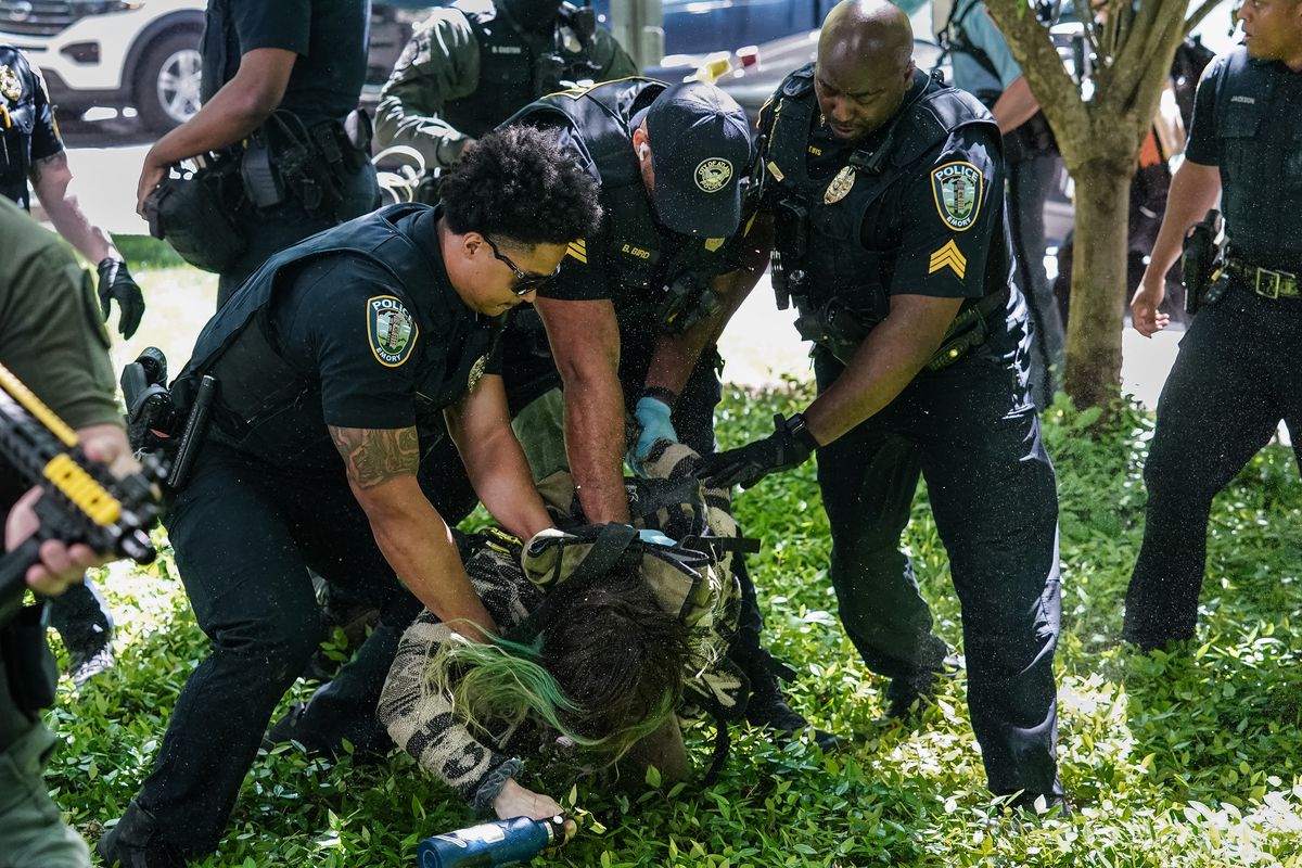Police officers arrest a demonstrator during a pro-Palestinian protest against the war in Gaza at Emory University on April 25, 2024, in Atlanta. College campuses across the US braced for fresh protests by pro-Palestinian students, extending a week of increasingly confrontational standoffs with police, mass arrests and accusations of anti-Semitism. (Elijah Nouvelage/AFP/Getty Images/TNS)  (Elijah Nouvelage/AFP)