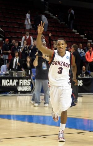Demetri Goodson of Gonzaga runs off the court and waves to acknowledge the Zag fans who stayed to cheer his winning shot against Western Kentucky in the Portland Or. Rose Garden. (Christopher Anderson / The Spokesman-Review)