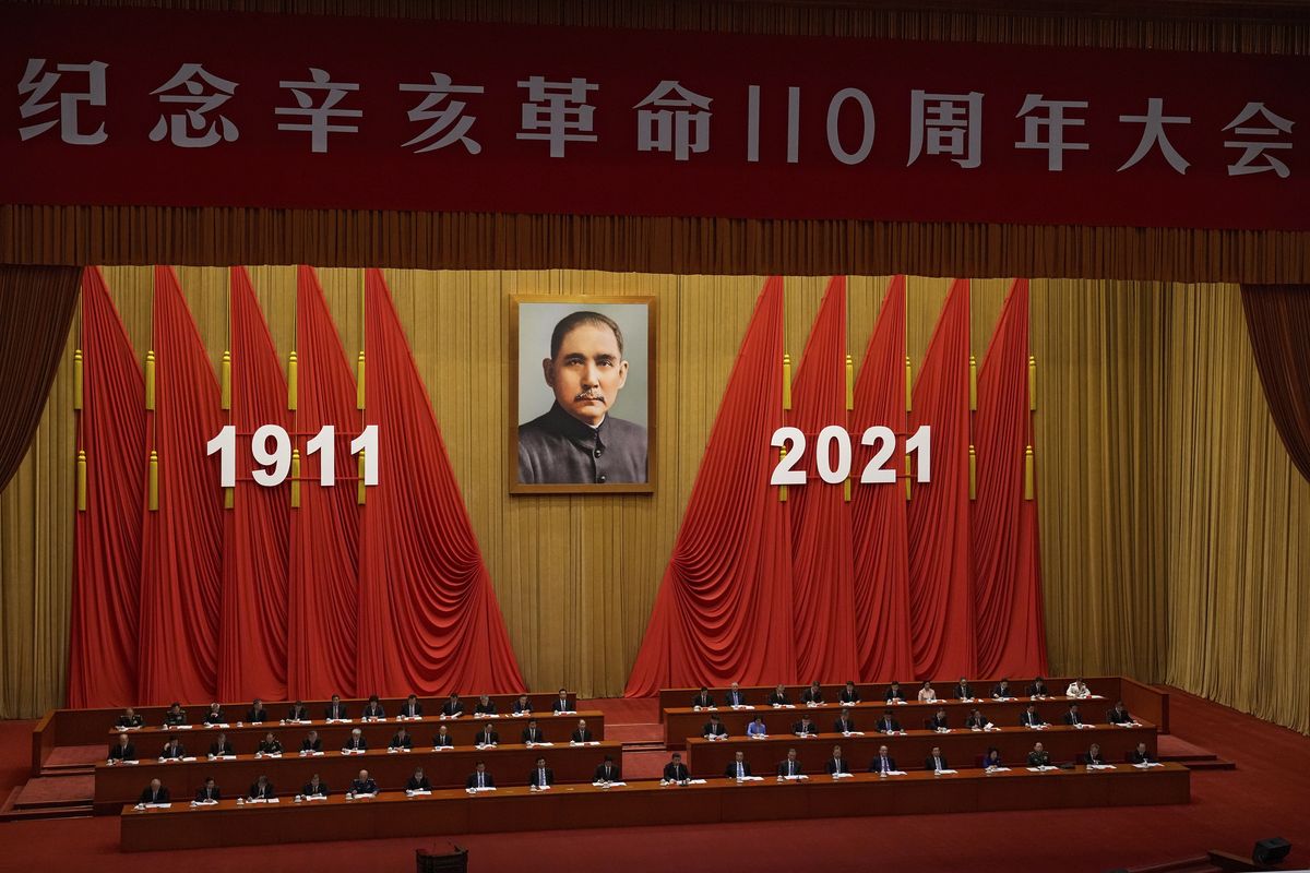 Chinese President Xi Jinping, center, delivers a speech at an event commemorating the 110th anniversary of Xinhai Revolution at the Great Hall of the People in Beijing, Saturday, Oct. 9, 2021.  (Andy Wong)