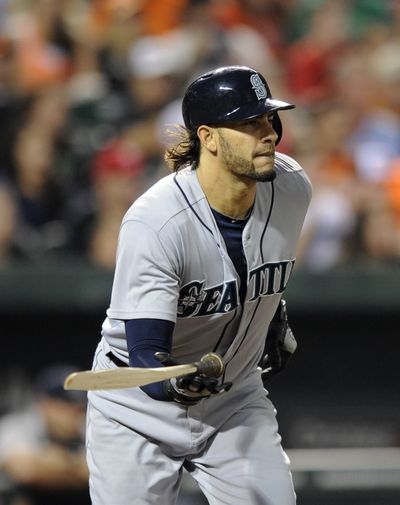 Mariners’ Michael Morse leaves his splintered bat behind after connecting for an RBI single. (Associated Press)
