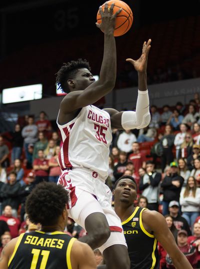 Washington State post Mouhamed Gueye attempts a shot against Oregon during the first half of a Pac-12 game on Sunday at Beasley Coliseum in Pullman.  (Geoff Crimmins/For the Spokesman-Review)