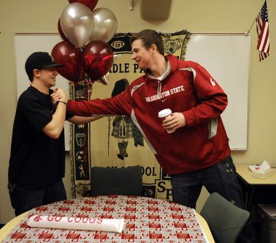 Shadle Park's Brett Boese, right, receives congratulations from Levi McBournie, Nov. 9, 2011 at the school, before Boese signed his letter of intent to play basketball at Washington State University.   (Dan Pelle / The Spokesman-Review)