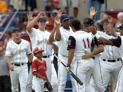 
Yakima's Chris Carter (11) is congratulated by his Eastern Division teammates after he won the Home Run Derby before Tuesday night's Northwest League All-Star Game at Avista Stadium. 
 (Colin Mulvany / The Spokesman-Review)