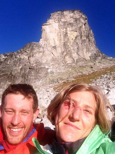 Ammi Midstokke is comforted by climbing partner Jason Luthy below Chimney Rock as she was being rescued from being pinned by a boulder.