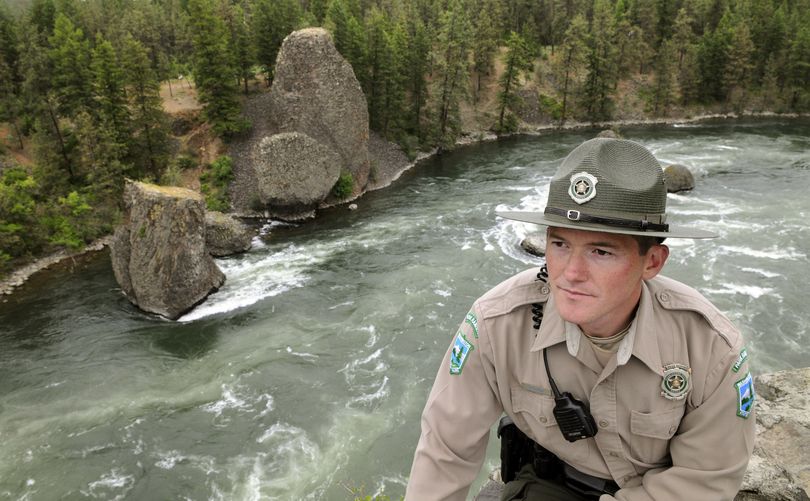Riverside State Park Ranger Brian Frahm pauses at the Bowl and Pitcher, where Washington’s new Discover Pass will be required on vehicles beginning July 5. (Dan Pelle)