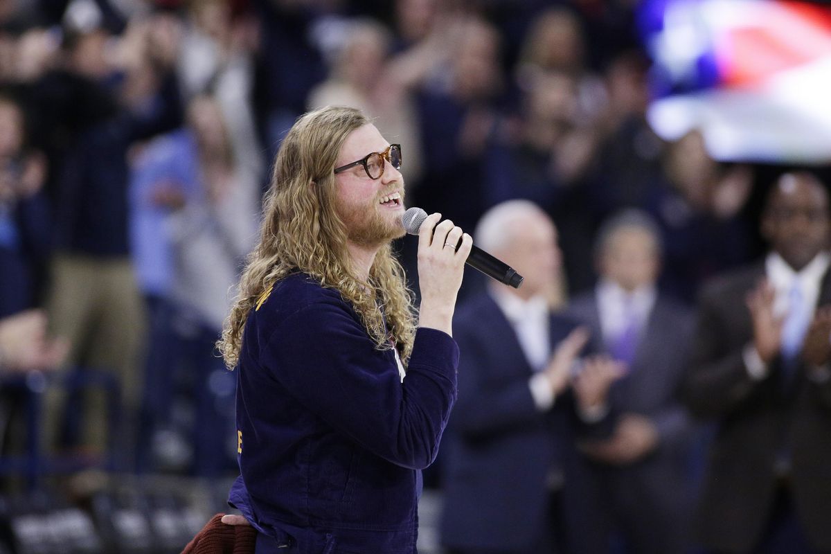 Singer-songwriter and musician Allen Stone of Chewelah sings “The Star-Spangled Banner” before an NCAA basketball game between Gonzaga and North Carolina in Spokane on Dec. 18. (Young Kwak / AP)