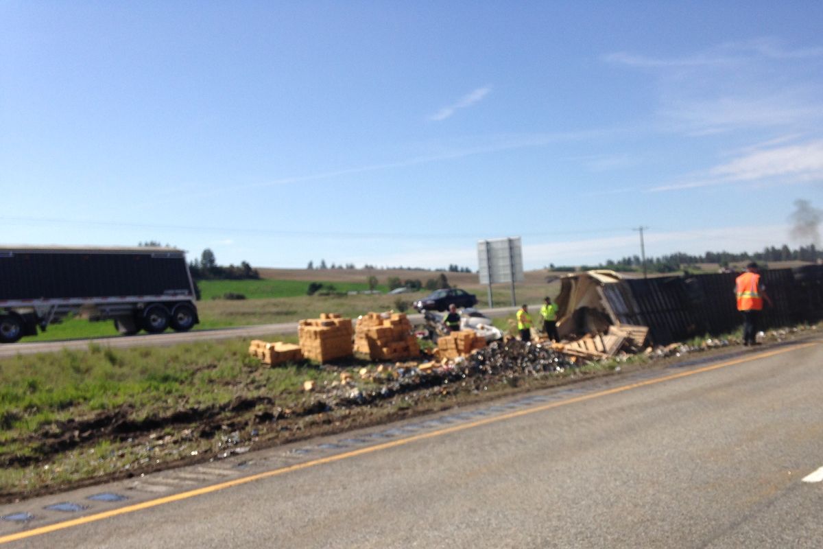 When two semis collided on Interstate 90 Friday, May 22, pet food was spilled all over the highway. (Scott Maben / The Spokesman-Review)