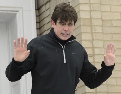 ORG XMIT: ILPB104 Illinois Gov. Rod Blagojevich talks to the media at his home in Chicago, Friday, Jan. 9, 2009. The Illinois House voted Friday to impeach Blagojevich. (AP Photo/Paul Beaty) (Paul Beaty / The Spokesman-Review)
