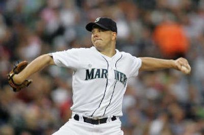 
Mariners starting pitcher Jarrod Washburn fires a third-inning pitch on Saturday.
 (Associated Press / The Spokesman-Review)