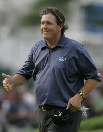 
Phil Mickelson produced one of the day's two under-par rounds.
 (Associated Press / The Spokesman-Review)