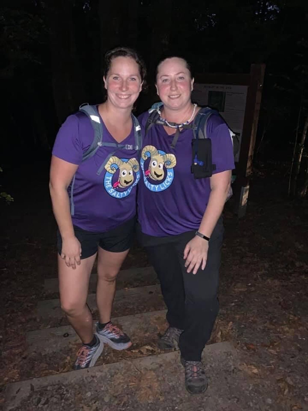 Amanda Nelson and her sister, Nicole Jonak, share a moment on a 31-mile benefit hike Oct. 3 to support cystic fibrosis research and in memory of their sister Krista Baker, who died at age 20 from the disease while awaiting a double lung transplant.  (Courtesy)