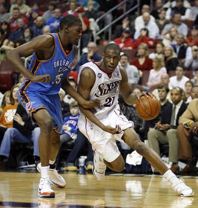 Associated Press Oklahoma City guard Kevin Durant, left, defends as 76ers forward Thaddeus Young drives to the paint. Philadelphia won 110-85. (Associated Press / The Spokesman-Review)