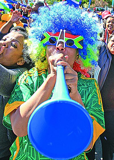 Supporters of 2010 South Africa World Cup blow plastic trumpets known as a vuvuzelas. (Associated Press)