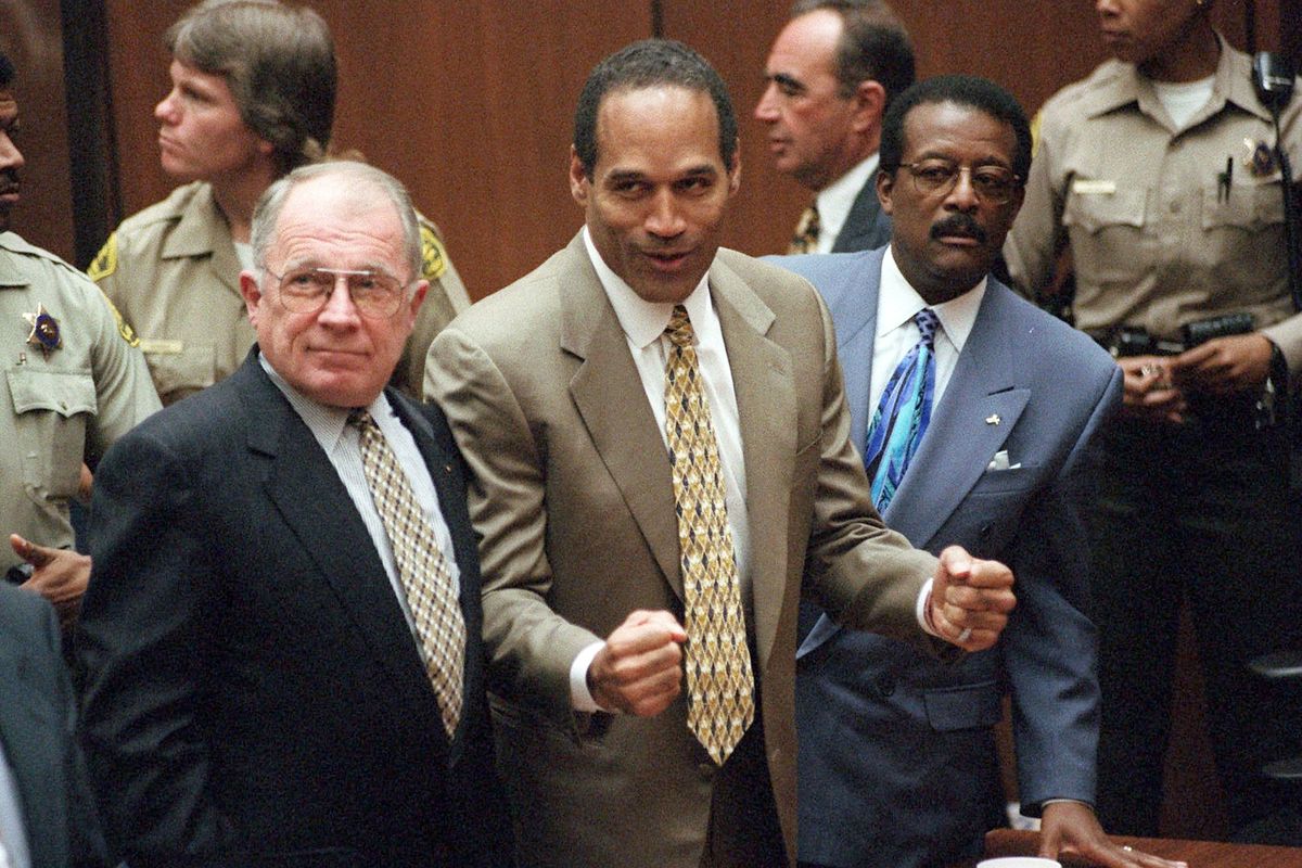 FILE - In this Oct. 3, 1995, file photo, O.J. Simpson reacts as he is found not guilty in the death of his ex-wife Nicole Brown Simpson and her friend Ron Goldman in Los Angeles, as defense attorneys F. Lee Bailey, left, and Johnnie L. Cochran Jr., stand with him. Bailey, the celebrity attorney who defended O.J. Simpson, Patricia Hearst and the alleged Boston Strangler, but whose legal career halted when he was disbarred in two states, has died, a former colleague confirmed Thursday, June 3, 2021. He was 87.  (Myung J. Chun)