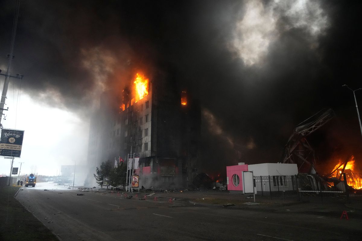 A building burns after shelling in Kyiv, Ukraine, Thursday, March 3, 2022. Russia has launched a wide-ranging attack on Ukraine, hitting cities and bases with airstrikes or shelling.  (Efrem Lukatsky)