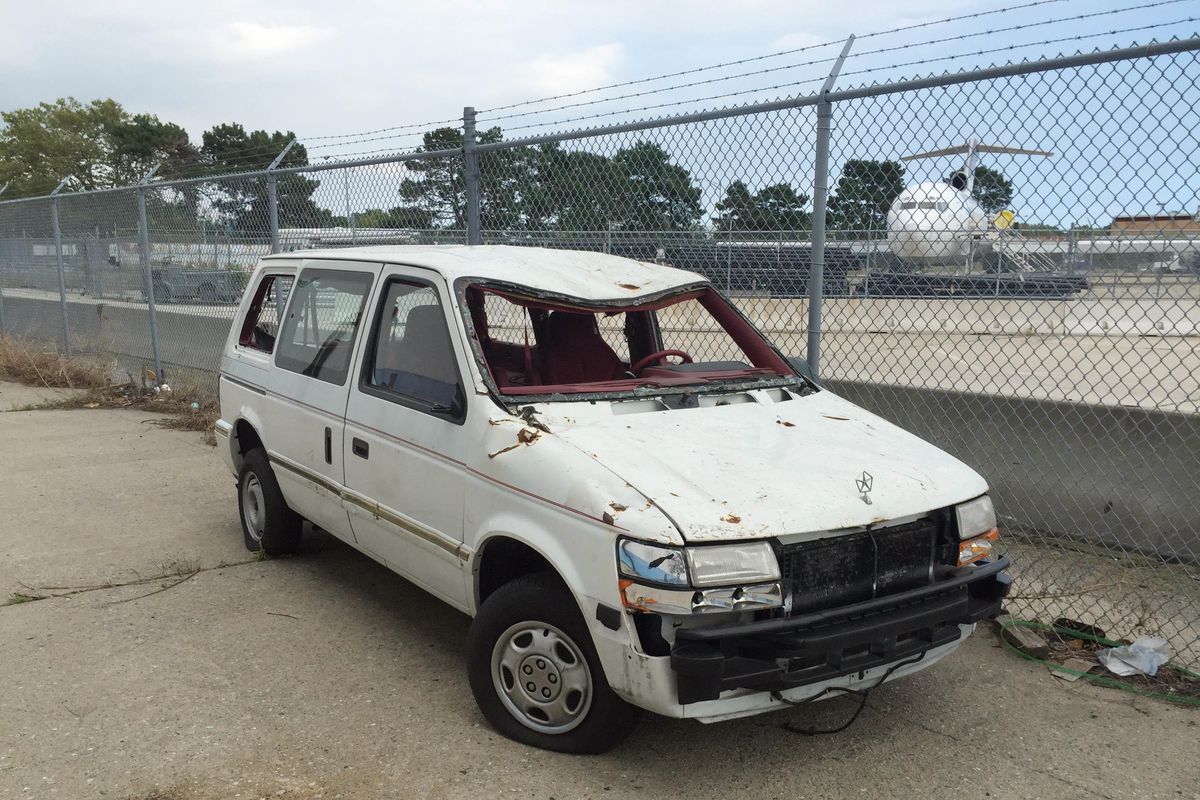 This Aug. 18 photo provided by the Port Authority shows a van damaged in the Sept. 11, 2001, terrorist attacks on the World Trade Center, outside Hangar 17 at the JFK airport in New York. When the Port Authority shuttered the artifact program in August, officials moved the only remaining artifact to the tarmac. (Amy Passiak / Amy Passiak Port Authority of New York and New Jersey)