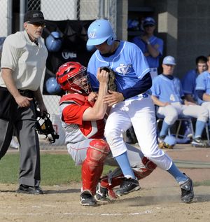 Ferris catcher Ryan Krustangel tags out Central Valley’s Joe Arlt at home plate Tuesday at CV. (Jesse Tinsley)