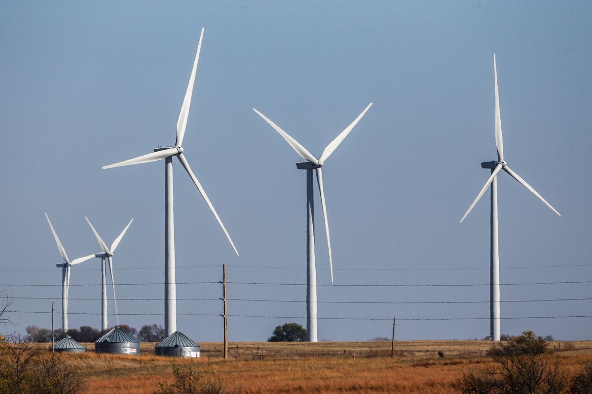 Wind turbines dot the landscape near Steele City, Neb., in November 2015. Wind turbines and solar panels accounted for more than two-thirds of all new electric generation capacity added to the nations grid in 2015, according to a recent analysis by the U.S. Department of Energy. The remaining third was largely new power plants fueled by natural gas, which has become cheap and plentiful as a result of hydraulic fracturing. (Nati Harnik / Associated Press)
