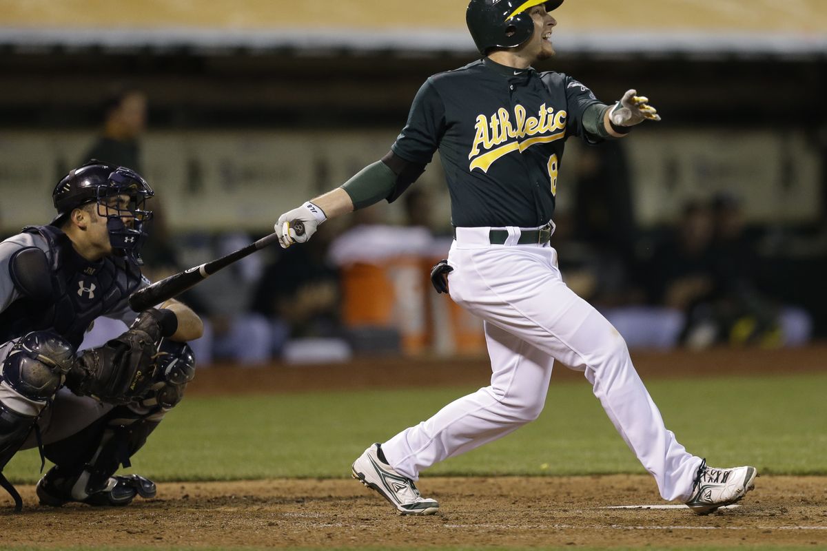 Oakland Athletics’ Jed Lowrie went 3 for 3 with three extra-base hits, including this seventh-inning home run that extended the A’s lead to 5-2. (Associated Press)